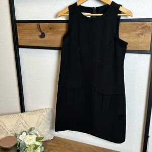 Women’s Donna Morgan black tank dress with front pockets and stretch - size 4